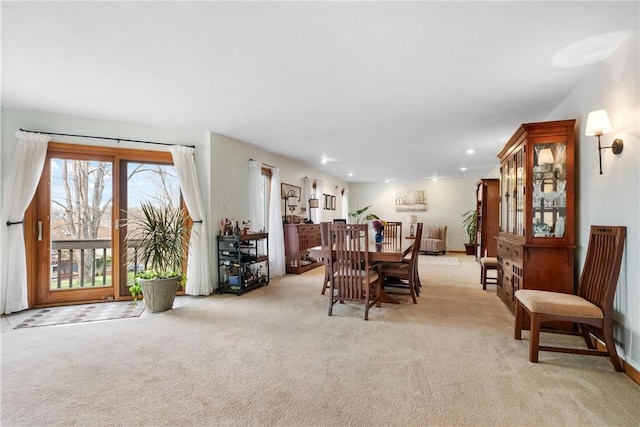 dining room with light carpet