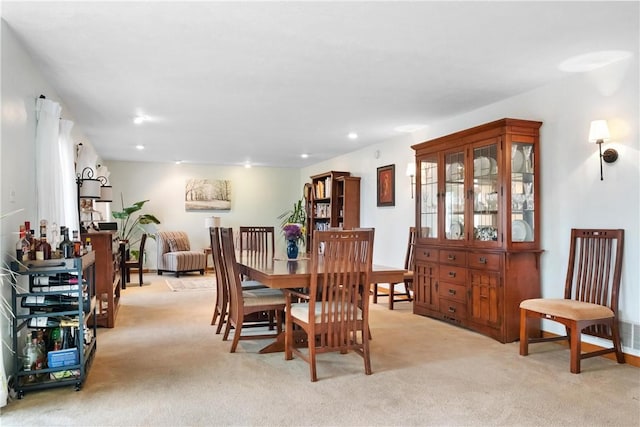 dining space with light carpet