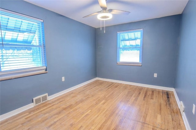 unfurnished room featuring ceiling fan and light hardwood / wood-style floors