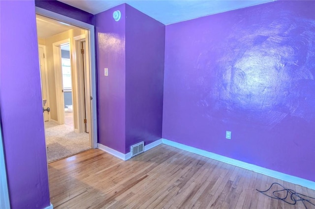 unfurnished room featuring wood-type flooring