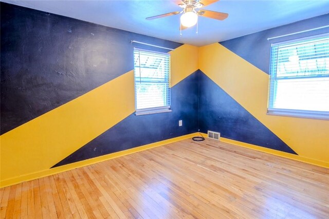 interior space featuring hardwood / wood-style floors and ceiling fan