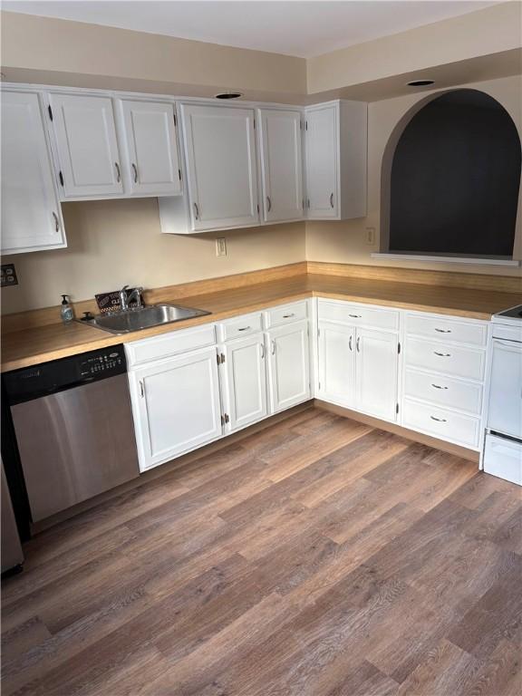 kitchen with white range with electric cooktop, sink, white cabinets, and stainless steel dishwasher