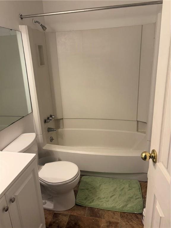 full bathroom with washtub / shower combination, vanity, and toilet