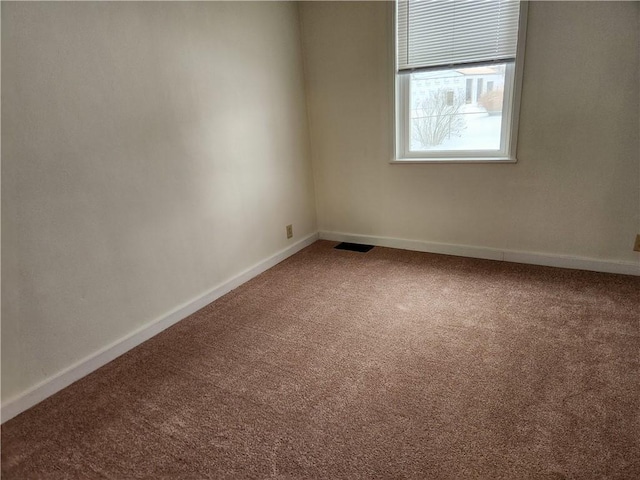 unfurnished room featuring carpet flooring