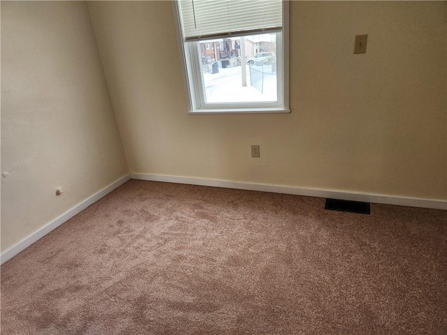 unfurnished room featuring carpet flooring