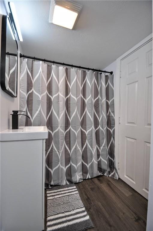 bathroom featuring vanity and wood-type flooring