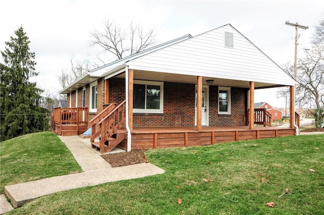 view of front of property with covered porch and a front lawn