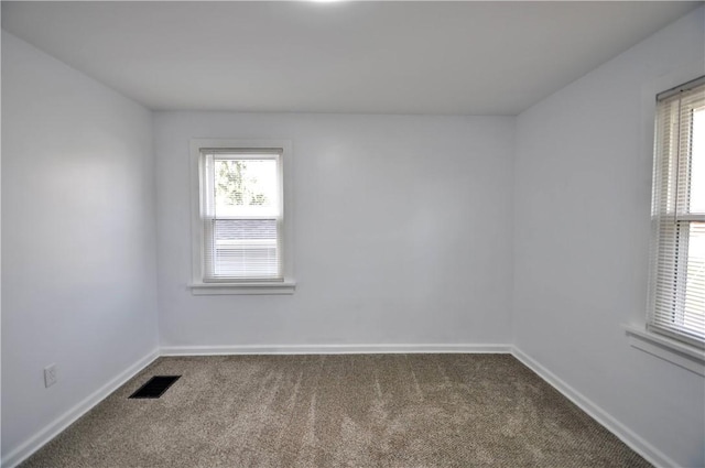 spare room featuring carpet floors