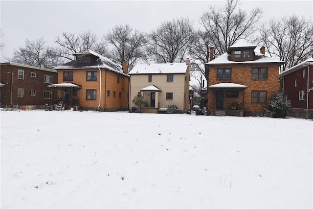 view of snow covered property