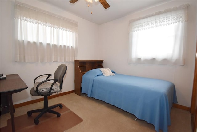 bedroom featuring ceiling fan and light colored carpet