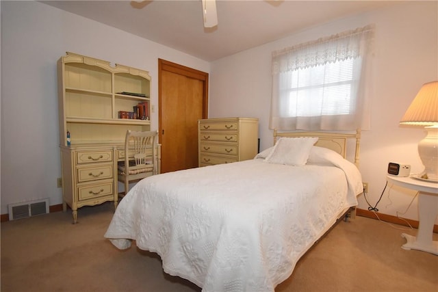 bedroom with ceiling fan and light colored carpet