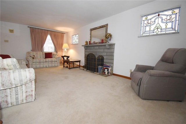 carpeted living room with a brick fireplace