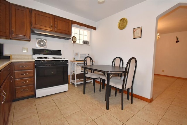 kitchen featuring white appliances and light tile patterned floors