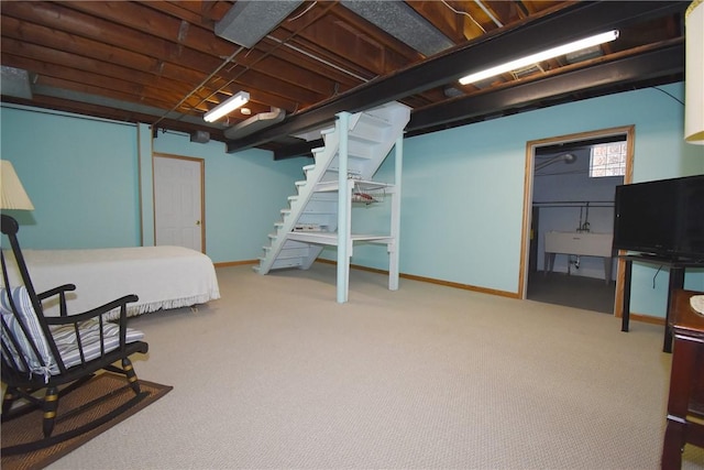 bedroom featuring carpet flooring and sink