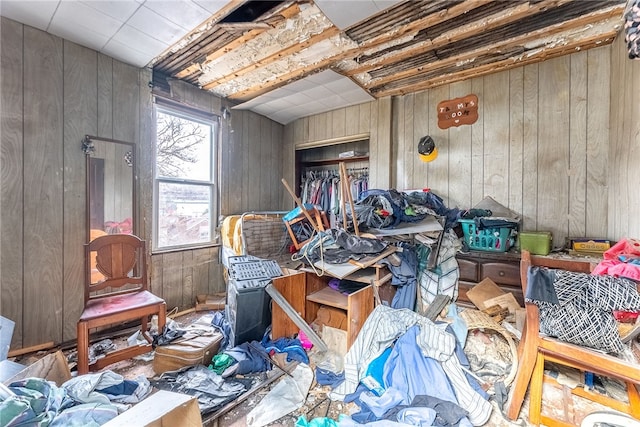 miscellaneous room featuring wooden walls