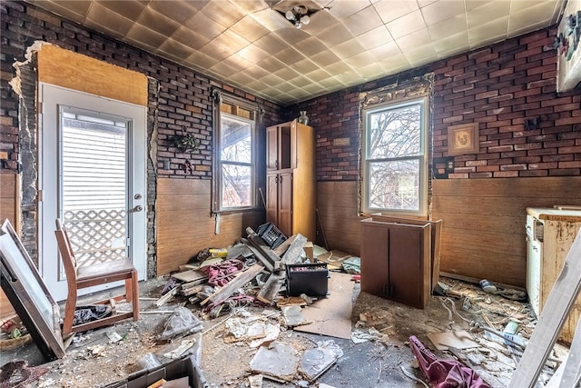 miscellaneous room featuring brick wall