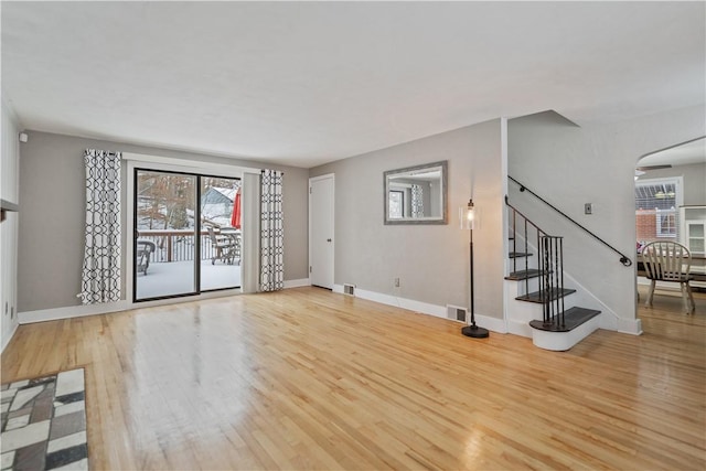 unfurnished living room with light wood-type flooring