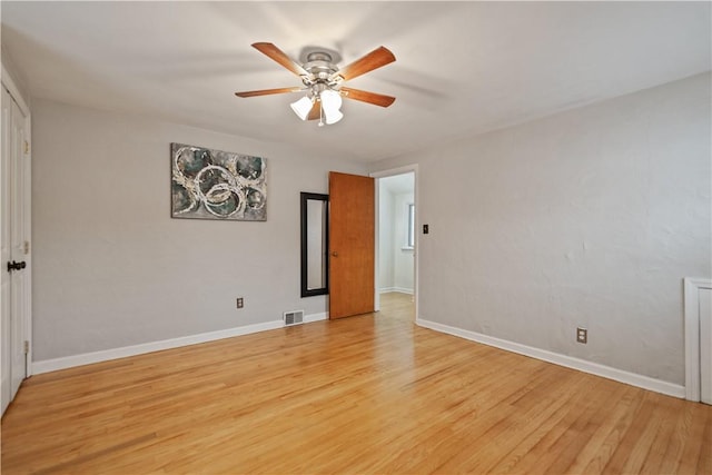 unfurnished room featuring ceiling fan and light hardwood / wood-style flooring