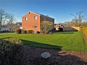 view of home's exterior featuring a lawn