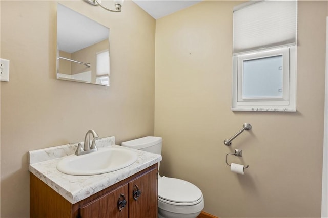 bathroom with toilet and vanity