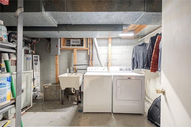 laundry room featuring gas water heater, separate washer and dryer, sink, and electric panel