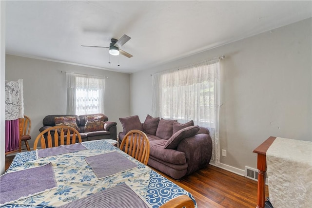 dining room featuring dark hardwood / wood-style flooring and ceiling fan