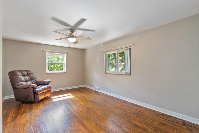 unfurnished room featuring dark hardwood / wood-style flooring and ceiling fan