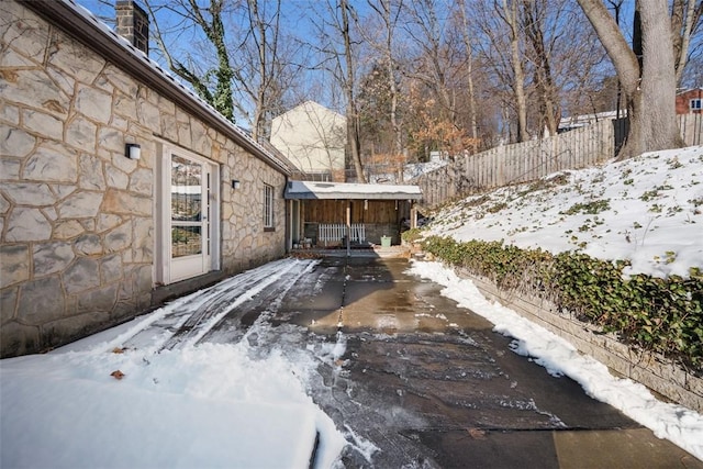 view of yard layered in snow