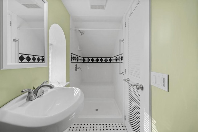 bathroom featuring sink and walk in shower