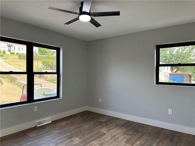 spare room with wood-type flooring and ceiling fan