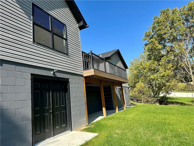 view of home's exterior with a yard and a wooden deck