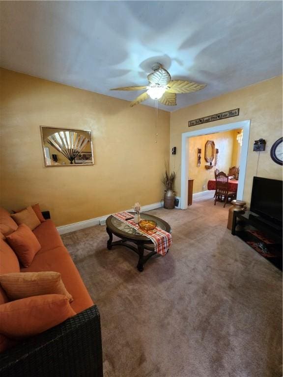 living room with carpet flooring and ceiling fan