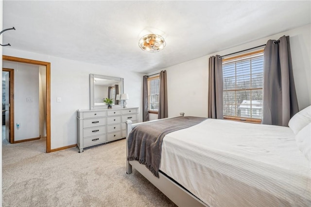 bedroom featuring light carpet