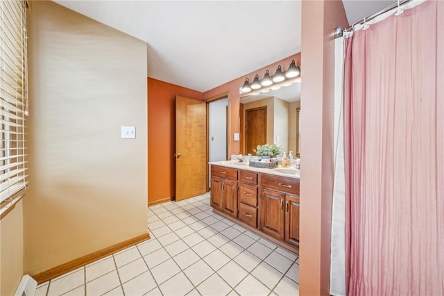 bathroom featuring tile patterned flooring and vanity