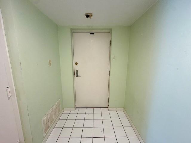 entryway with light tile patterned floors