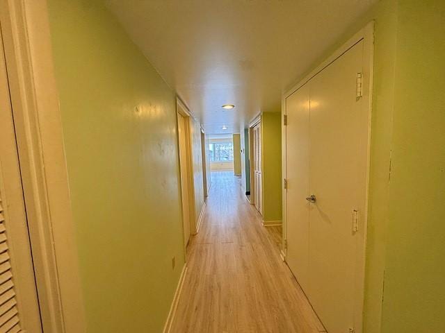 hallway with light wood-type flooring