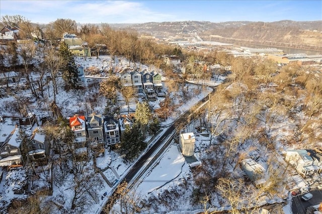 snowy aerial view with a mountain view