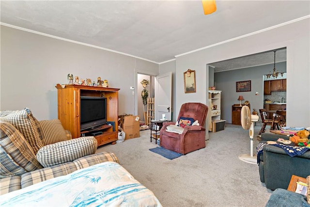 carpeted living room featuring a chandelier and ornamental molding