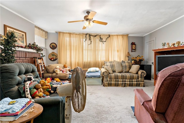 carpeted living room with ceiling fan and ornamental molding