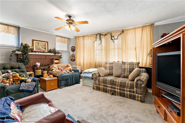 living room featuring ceiling fan, carpet floors, and crown molding