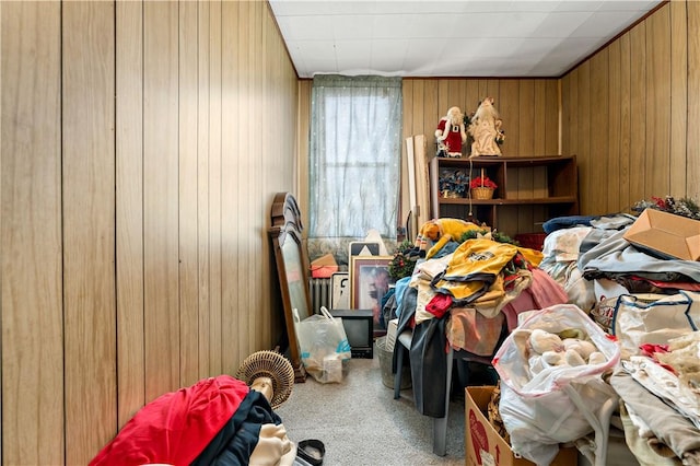 bedroom featuring wood walls