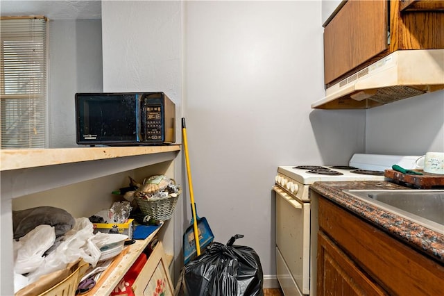 kitchen featuring white range