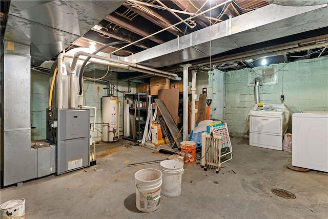 basement featuring independent washer and dryer, gas water heater, and heating unit