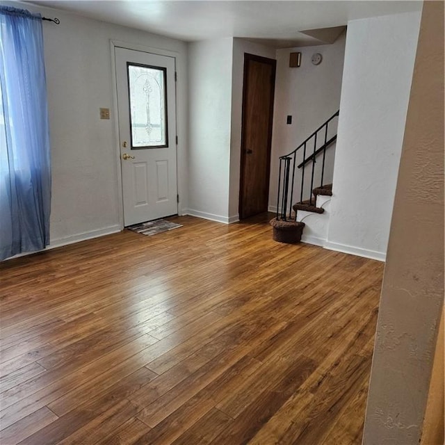 entryway with hardwood / wood-style floors