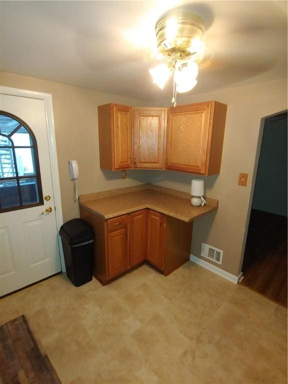 kitchen featuring ceiling fan