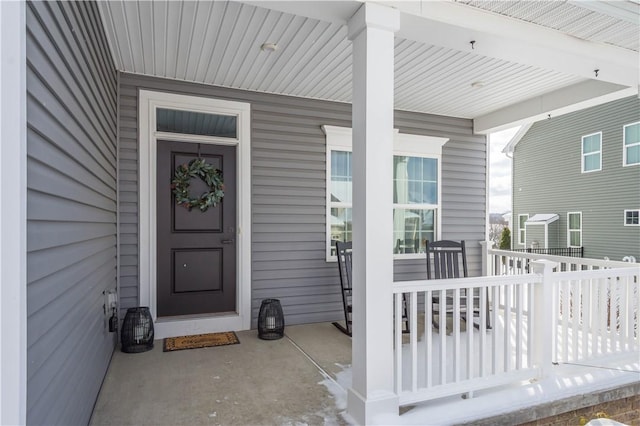 property entrance featuring covered porch