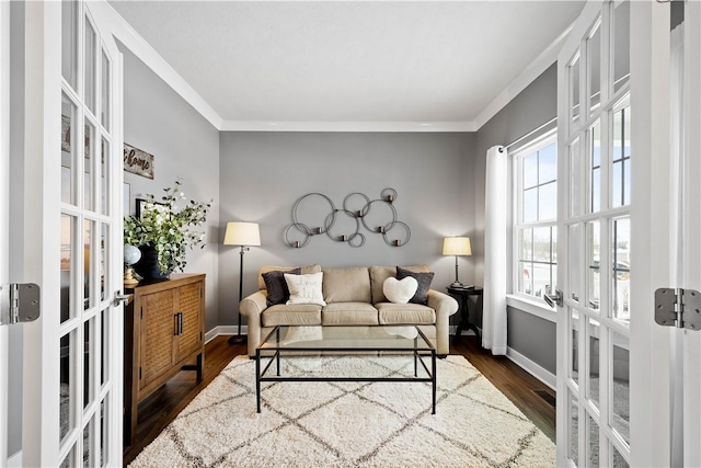 living room with dark wood-type flooring, french doors, and crown molding