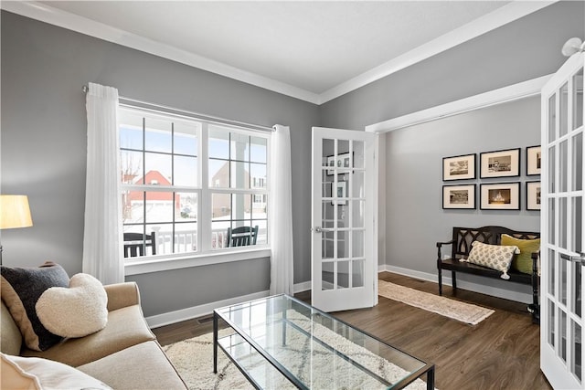 interior space with french doors, crown molding, and dark hardwood / wood-style floors