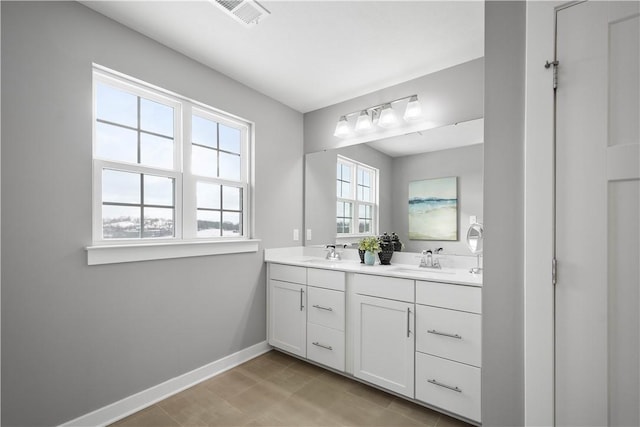 bathroom featuring vanity and tile patterned flooring