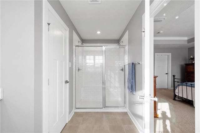 bathroom with a shower with shower door